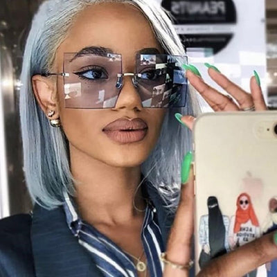 Beautiful Woman Taking selfie in luxury box frame glasses